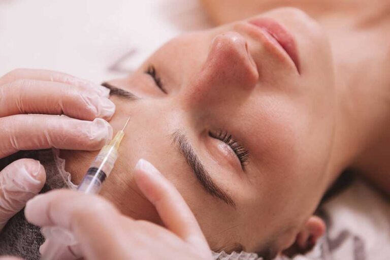 woman is getting botox injected