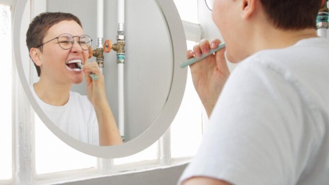 Adult brushing teeth for daily oral hygiene