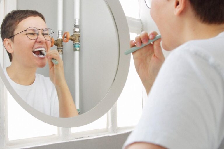 Adult brushing teeth for daily oral hygiene