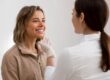 Smiling woman sitting in dental chair during appointment