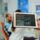 Dentist showing dental X-rays on tablet to patient