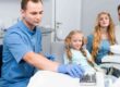 Parents supporting their child during a dental clinic visit.