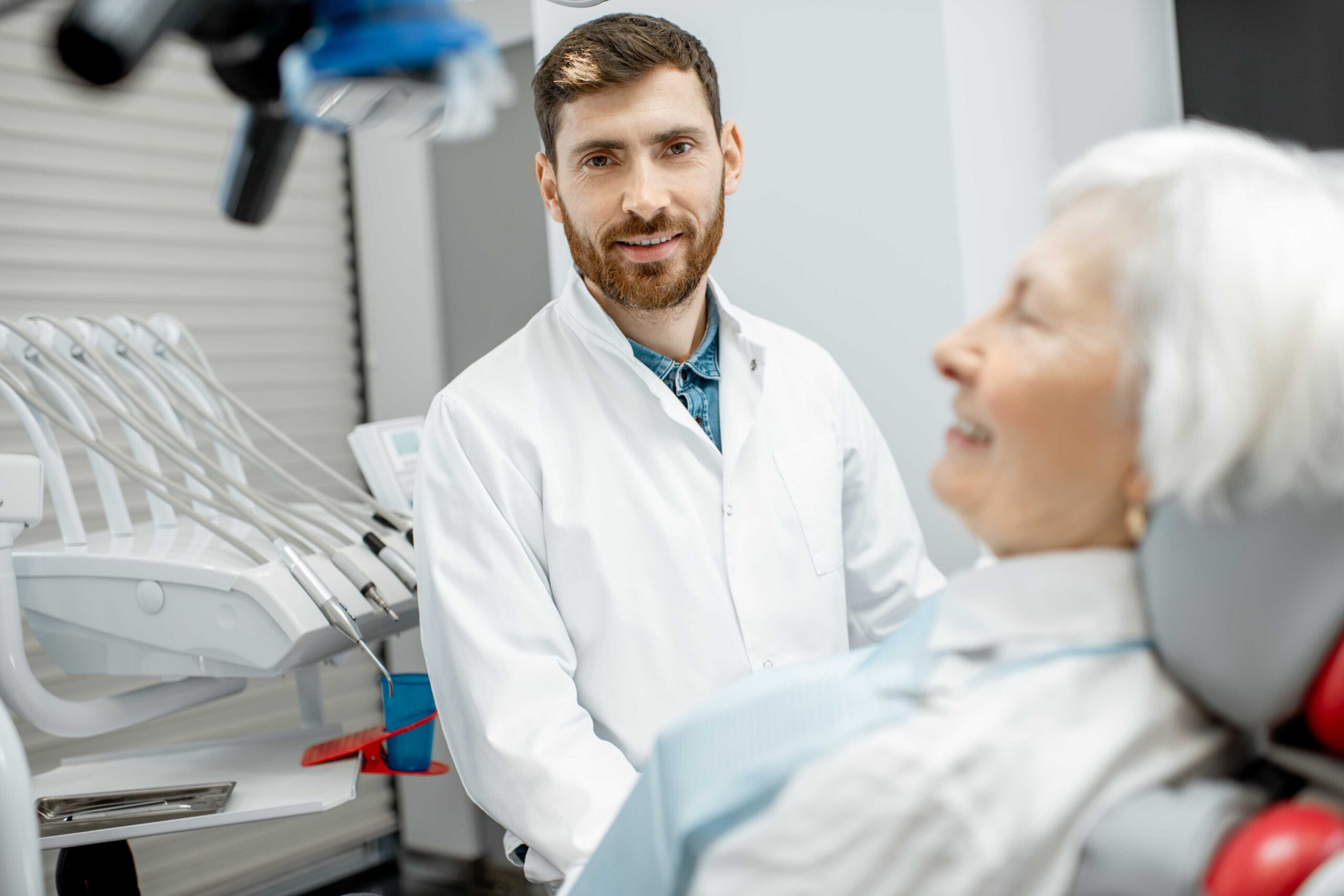Friendly dentist and patient in a dental office.