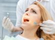 Patient receiving a dental examination for tooth pain.