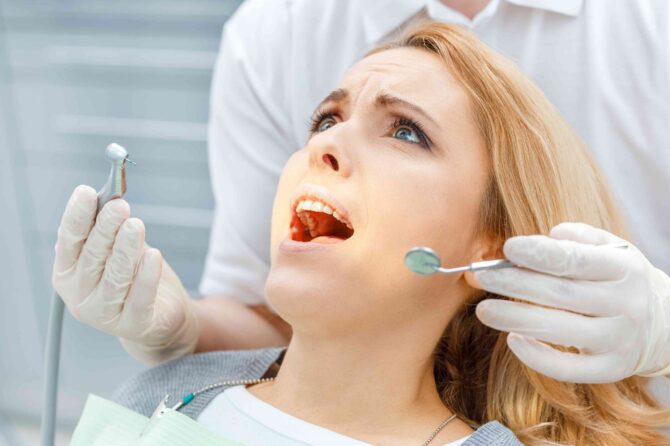 invisalign-bite-alignment-guide Patient receiving a dental examination for tooth pain.
